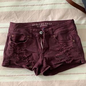 Maroon ripped shorts